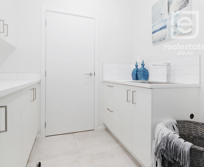 Separate laundry with generous storage