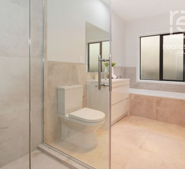 Family bathroom with tiled shower and bath